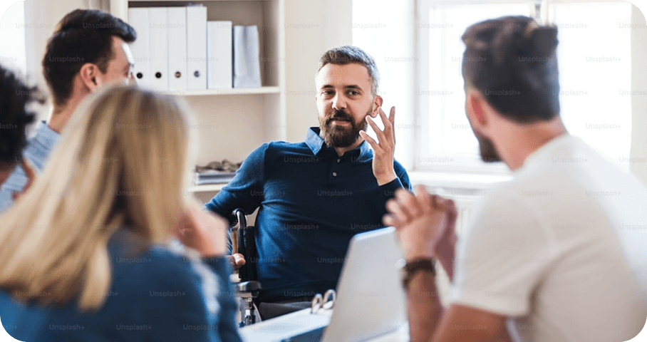 Team members collaborating in a modern office meeting.